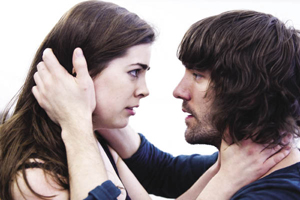 A man and woman (actors) rehearsing an intense scene in close up